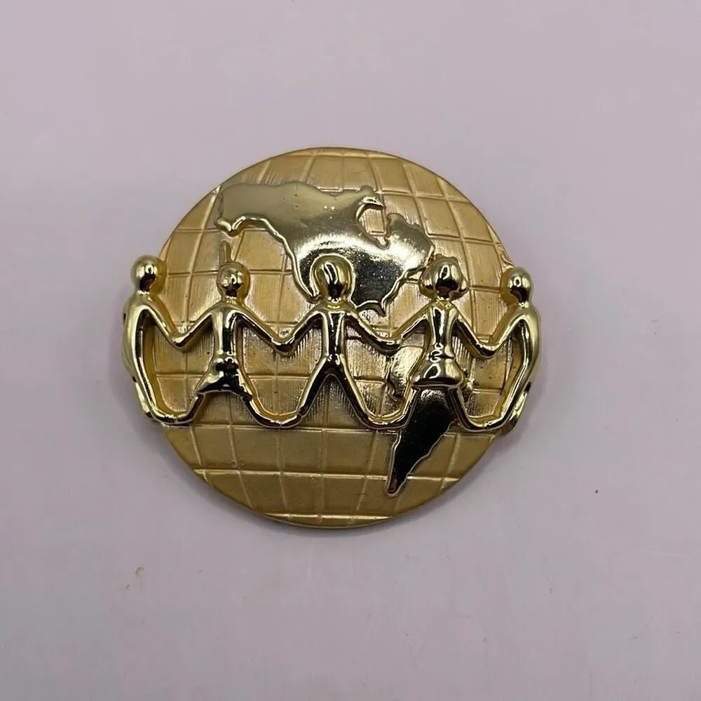 Signed AJC Globe Children Holding Hands Lapel Pin Brooch Goldtone Metal